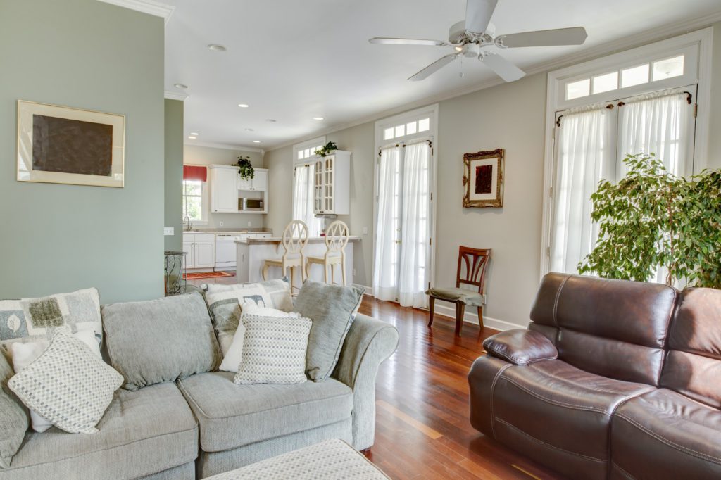 A sunny, spacious living room, perfectly organized.